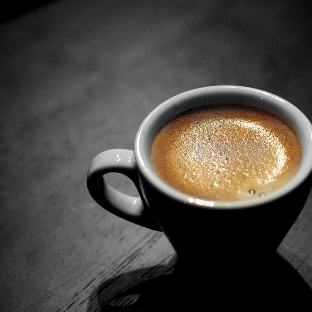 A dark, glossy shot of Origin Twenty Three coffee